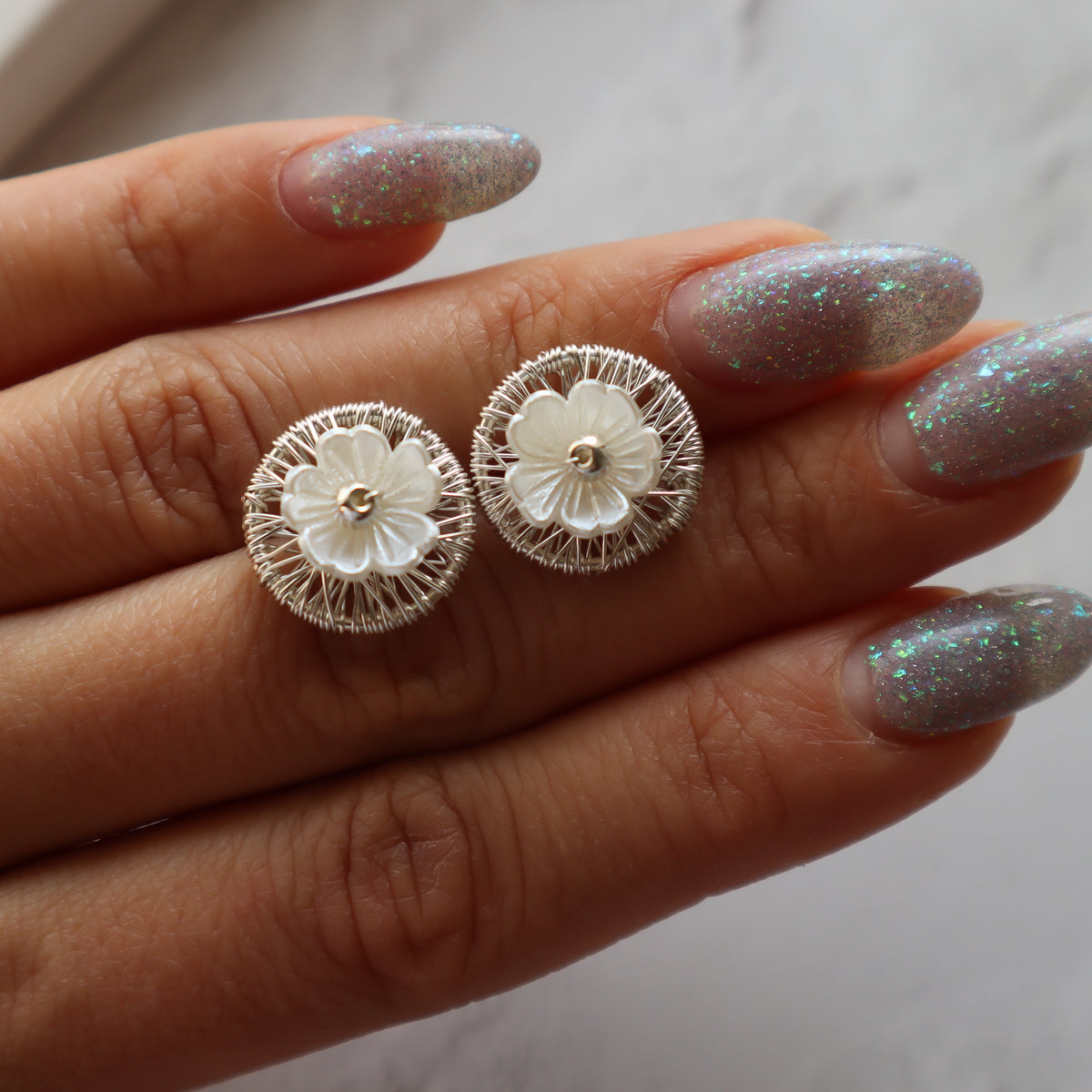Aros boton Floreado plateado